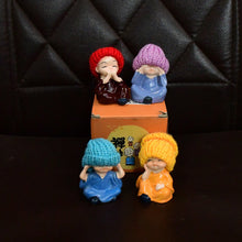 Decorative Resin Monk Buddha Showpiece Set of 4 with Traditional Straw Hats